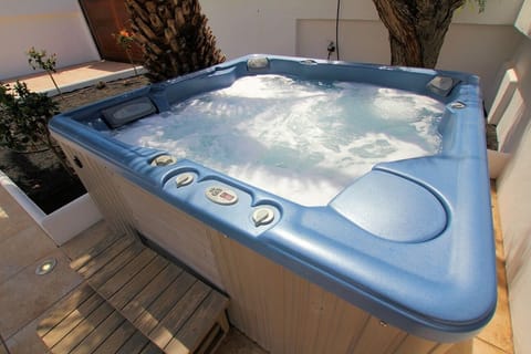 Sipping cocktails in the large 6 seater Hot Tub