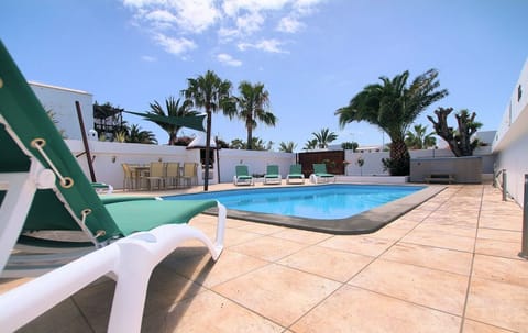Large heated swimming pool, comfortable sun beds, hot tub and alfresco dining.