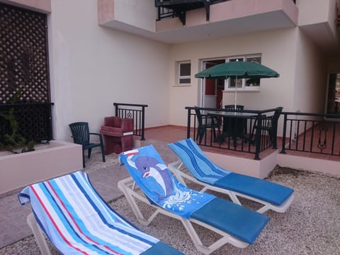 Private garden area with sun loungers.