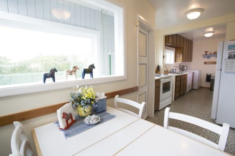 Kitchen nook surrounded by windows. 