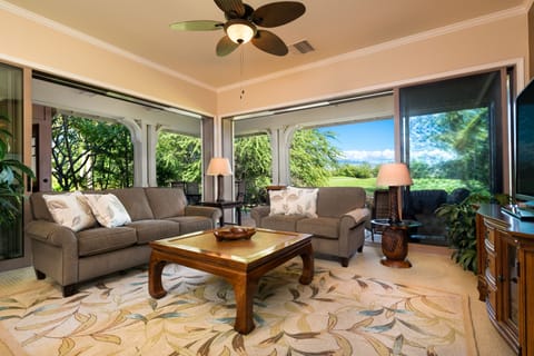 Open Living room features a wall of sliders for that Hawaii outdoor living feel.