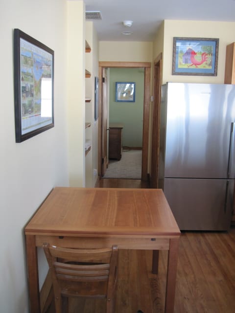 The dining room table has leaves that pull out for additional table space.