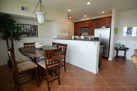 Dining area with kitchen in the background