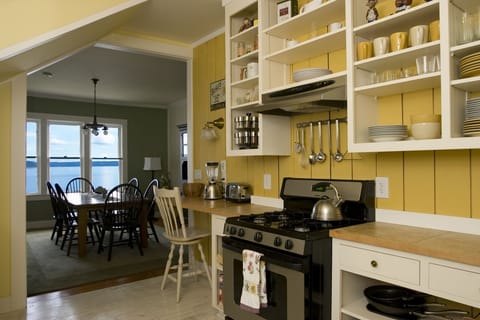 Large open concept kitchen with original antique sink and sweeping views.