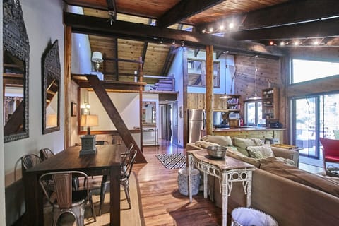 Other view from front door of living/kitchen/loft/dining area (photo of pre-reno