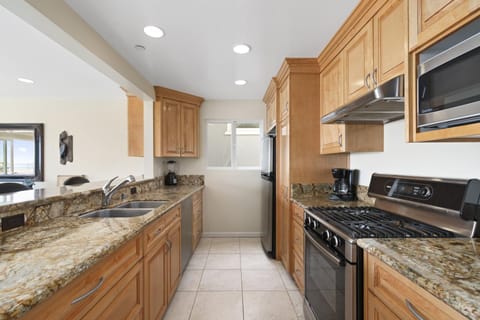 The kitchen comes stocked with dishes, utensils, cookware, bakeware, and all major and small appliances.