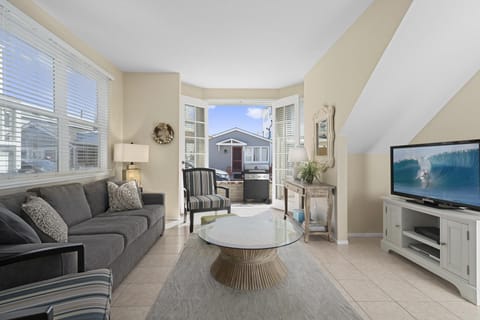 Neat as a pin, this downstairs split level unit is just a half block from the 27th Street beachfront and boardwalk.