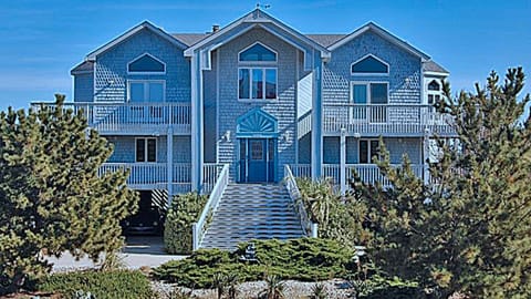 West Elevation Overlooking Landscaping and Driveways to Carports for 4 Cars