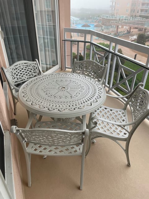 New table and chairs on the balcony.  Umbrella is inside if you need it.