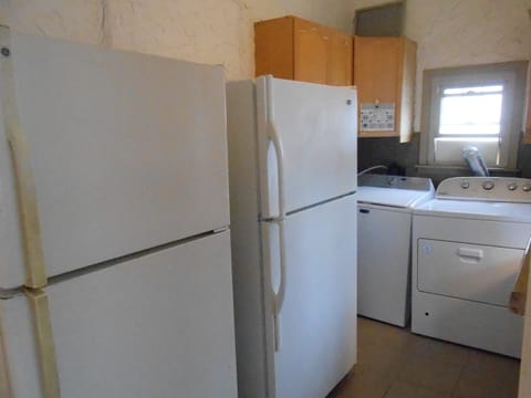 At Rear Main level, 2 extra Refrigerators/Freezers, 1 Washer/ Gas Dryer