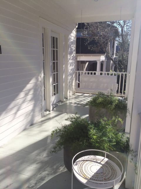 Enjoy morning coffee, breezy afternoons, and lovely  evenings on the front porch