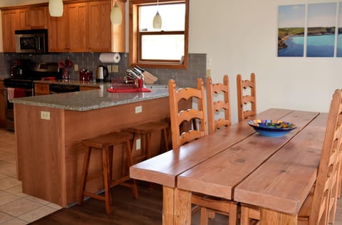 Dining table seats up to 10 people, plus breakfast bar