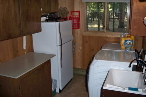 Utility room with  XL washer/dryer and additional refrigerator/freezer