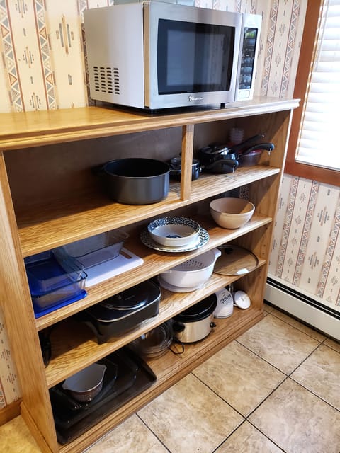 Kitchen fully stocked with microwave, pots & pans, slow cooker, bakeware, etc.