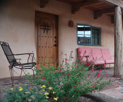West portal in courtyard with xeriscaping 
