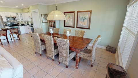 Dining table for 8, plus 2 barstools at the island.