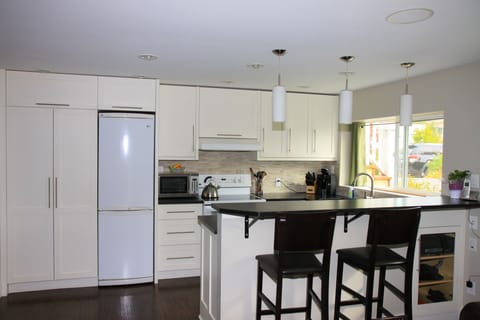 Custom kitchen with bar seating for up to 4.