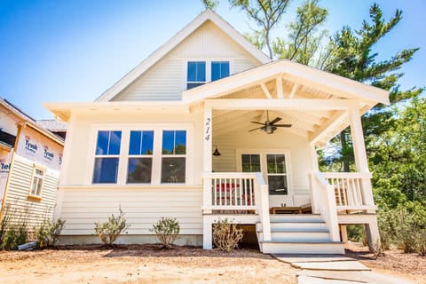 Spacious raised porch overlooking community gardens and best of all, no street!