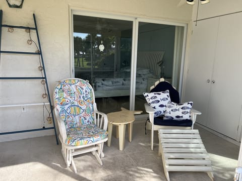Relax in the lanai. Storage for umbrellas and chairs. Ladder rail for wet towels