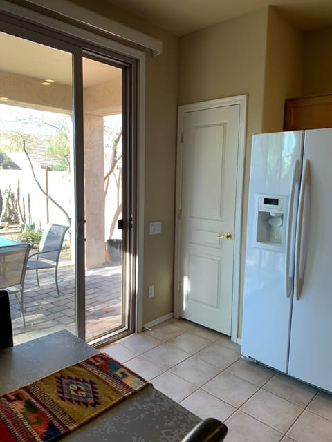 Kitchen leads has expansive patio doors leading to grill, and outdoor dining.