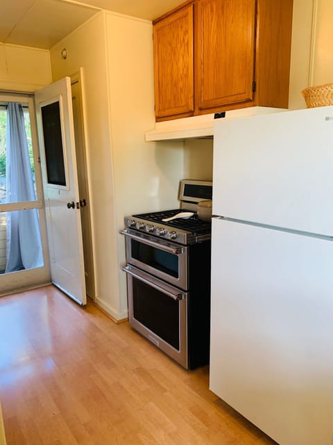 New Kitchenaid Gas Stove - Refrigerator is apartment size