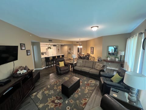 Large living room area with open dining room & kitchen