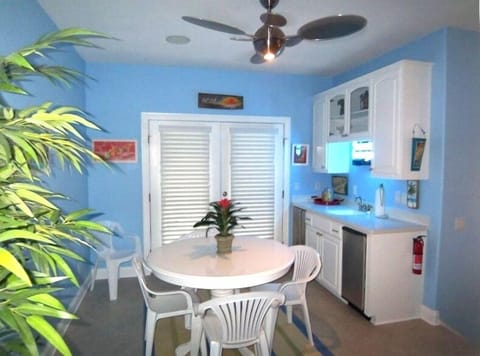 Sunset lounge and wetbar; doors open to a great balcony and views of the island