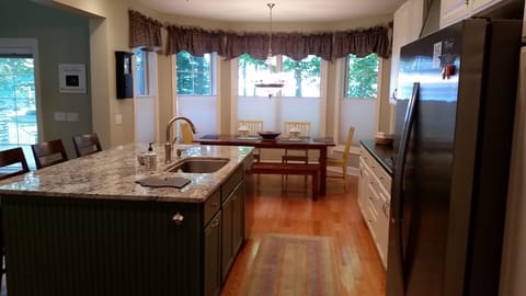 Full kitchen with granite counters and view of Lake Michigan