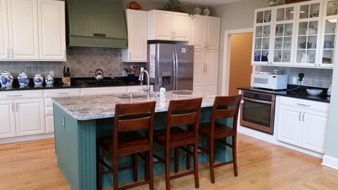 Kitchen with new cabinetry and granite counters