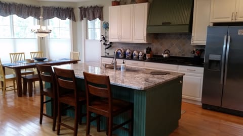Kitchen with dining table that sits 7 (counter sits 3) 
