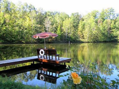 The well-stocked, spring fed, 5-acre McCormick Lake is surrounded by trees.