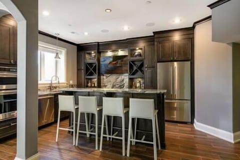 Basement Wet Bar, ice maker, 50" tv, full refrigerator, dishwasher and additional oven/microwave