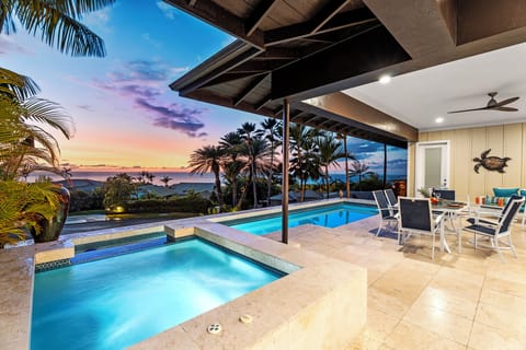 Unwind in the private pool and spa with stunning island views.