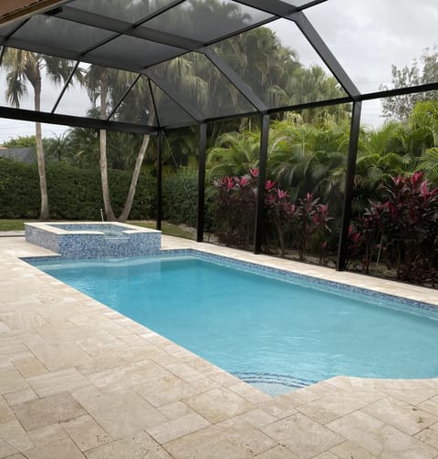 Secluded, tropical backyard with complete privacy!  Brand new pool and spa 