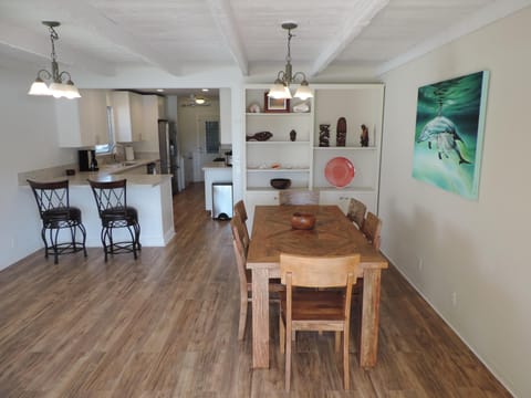 Dinning Room With Solid Teak Table and Brand New Kitchen With Bar