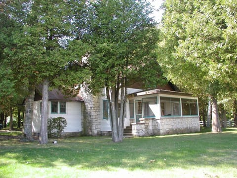 Looking at the Shorecrest house and screened porch from the water.