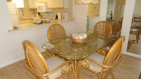 Sunny equipped kitchen and comfortable dining with seating for 6.