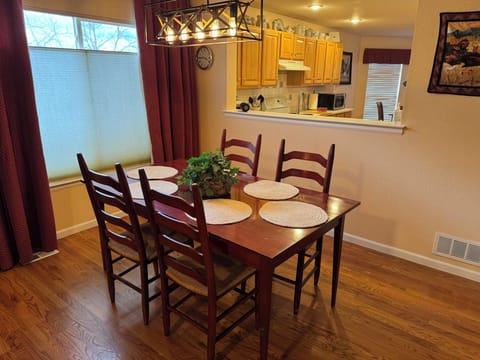 Dining room with view into kitchen