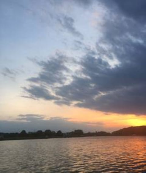 Enjoy sunsets from the back yard with private pier.