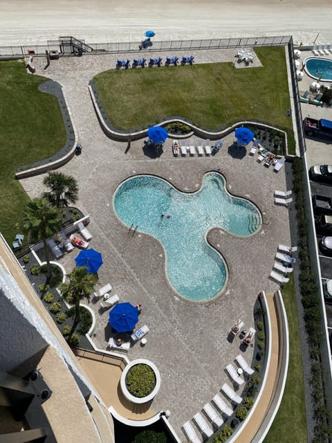 View off main balcony of newly renovated pool area with ocean front fire pit.