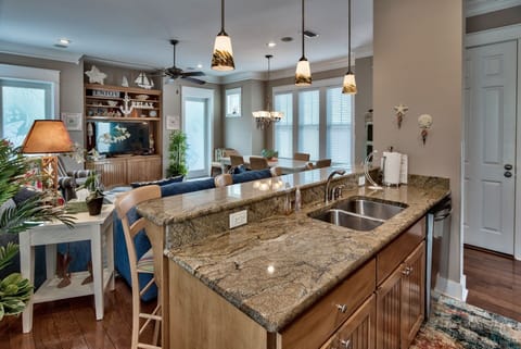 View from kitchen to dining.  Very inviting for an after the beach beverage.