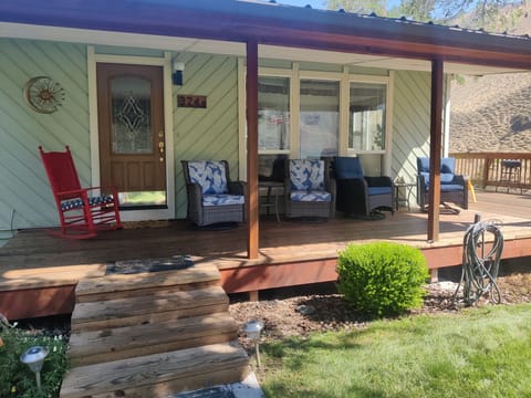Beautiful front porch to take in the river view from the  front yard! 