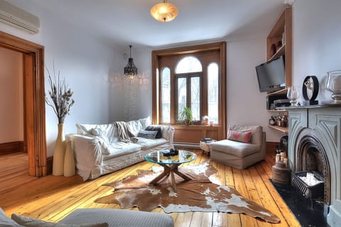Living room with beautiful 10 ft ceiling window!