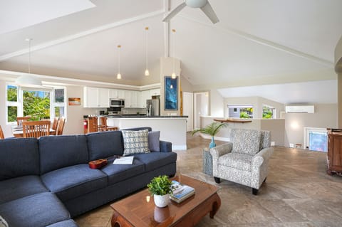 Gather with loved ones in the open-concept living room and kitchen, designed for relaxation and connection.