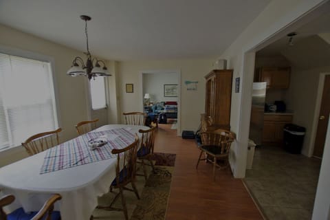 Looking at front entry  (door on left) / dining area and kitchen & living room