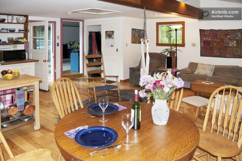 Relax at dining table (extra leaves), on couch or swing- note door to sun porch.