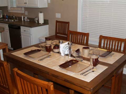 Gathering height dining table, opens wider to seat eight.