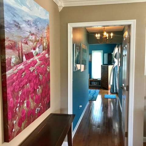 Hardwood floors lead to lakefront Maui King Bedroom.