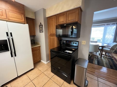 Kitchen with table and chairs and dining
outside or in Dining Room.