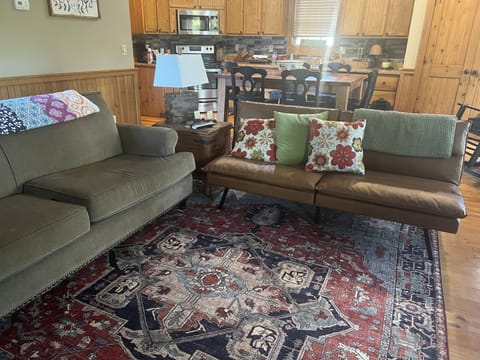 Open den with seating for 8 and open to kitchen and outside deck